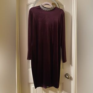 Plum velvet cocktail dress w/ pearl mock neck, long sleeves, hits at knee.